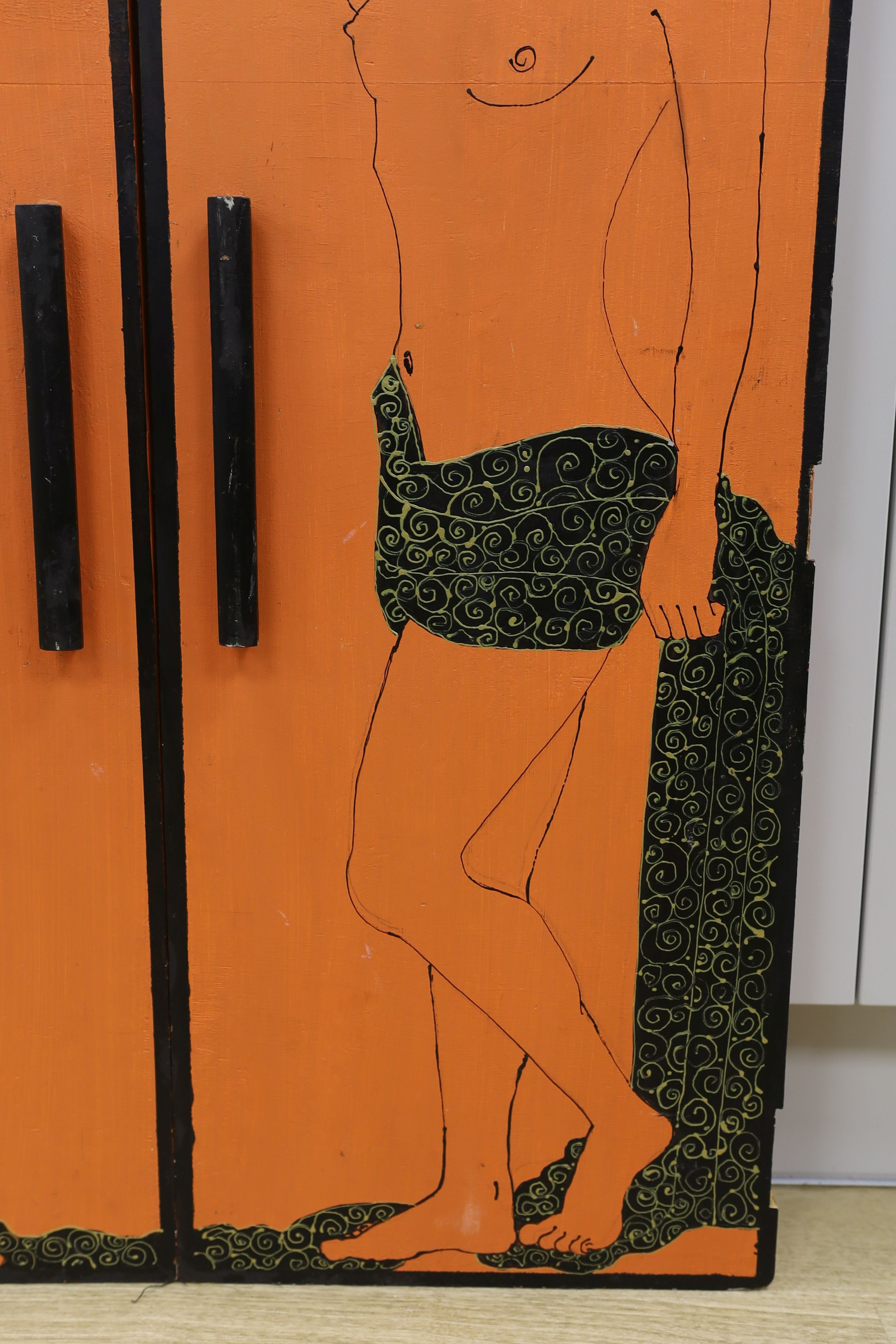 A pair of orange painted figural 1960's cabinet doors, by repute from 'Biba', 36cms wide x94 cms high.